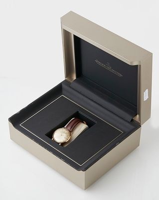 an image of a watch in a box on a white surface