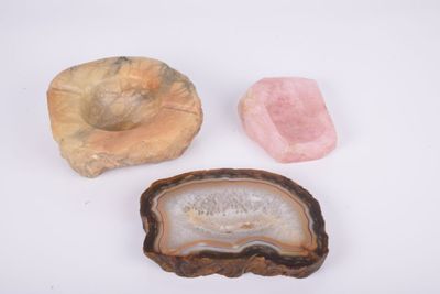 three different types of rock and stone on a white surface