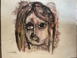 drawing of a woman ' s face on a piece of paper