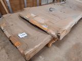 two cardboard boxes sitting on a pallet in a room