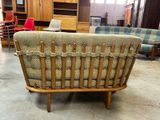 an image of a living room with a couch and chairs