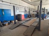 a garage with a lot of tires on the floor