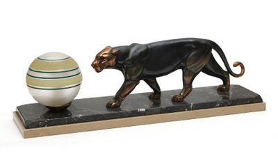 statue of a black cat and an egg on a marble stand