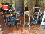two tables and two chairs in a room with a wallpapered wall