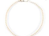 a white pearl necklace with a gold clasp on a white background