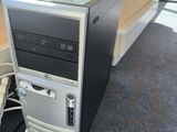 a computer that is sitting on the floor next to a chair