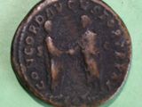 a coin with a picture of a man and a woman on it