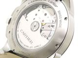 a close up of a watch on a white background