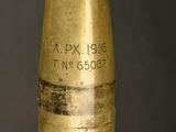 a close up view of a brass bullet on a black background