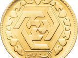 a close up of a gold coin on a white background