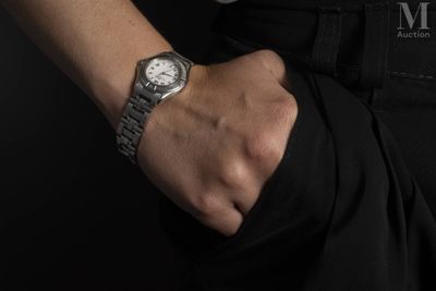 a man that is wearing a watch on his wrist