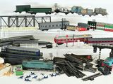 a lot of toy trains that are sitting on a table