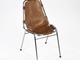 an image of a brown leather chair on a metal frame