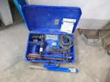 a blue tool box with tools in it on the floor