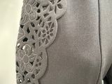 a close up of a dress with a lace on it