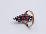 an image of a ring with pink stones on it