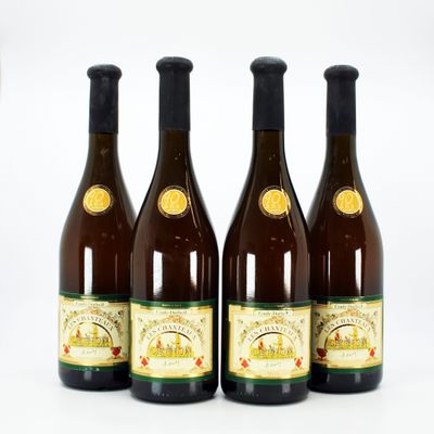 three bottles of wine sitting next to each other on a white surface