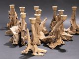 five wooden candlesticks that are sitting on a table