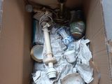 a cardboard box with a bunch of items inside of it