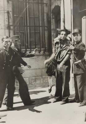 black and white photo of a group of men standing on a sidewalk