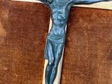 a statue of jesus on a cross on a table