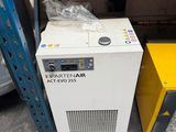 two air dryers sitting next to each other in a warehouse
