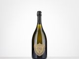 a bottle of champagne sitting on top of a table