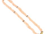 a long beaded necklace with a gold clasp and a gold star charm