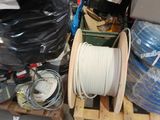 a pile of wires and other items on a pallet