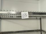 a picture of a metal shelf with a sign on it