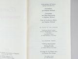 someone is holding a book open to a page with a list on it