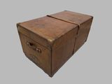 an old suitcase that is sitting on top of a table