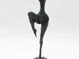 an image of a bronze statue of a woman in a pose