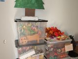 a stack of plastic bins with christmas decorations on them