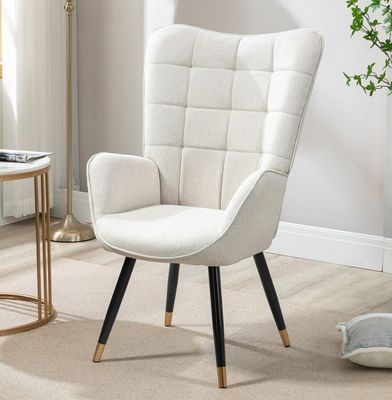 a white chair with a black legs in a living room