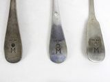 four spoons that have the words mom engraved on them