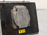a black box that has a yellow button on it
