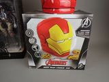 toy iron man helmet sitting on top of a box next to a box of cookies