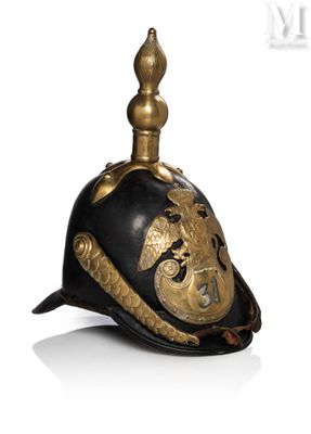 an old helmet with a dragon on the top and a dragon on the side