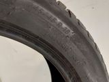 a close up of a tire on a white surface