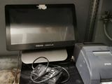 a computer and printer sitting on a desk in a room