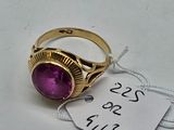 purple stone ring with a price tag on a white surface