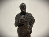 a statue of a man with a shaw around his neck