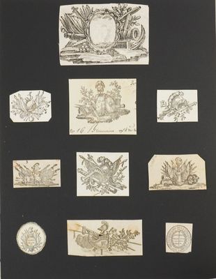 a black and white photo of a bunch of stamps on a table