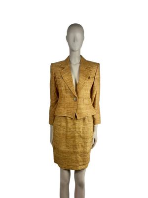 an image of a mannequin wearing a suit and skirt