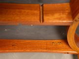 a close up of a wooden bench with writing on it