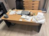 a wooden desk with a laptop on top of it