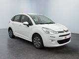 a white citrole is parked in a white room