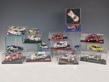 many different models of cars in a display case