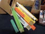 many different colored pencils in a box on the floor